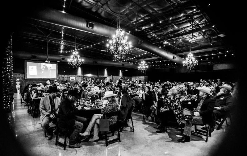 Guests at dinner tables at Boots &amp; Bling 2025