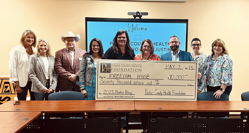 Freedom House with check from PCHF
